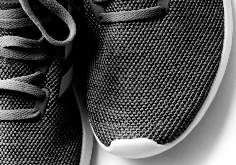 Close-up view of a running shoe highlighting its mesh.